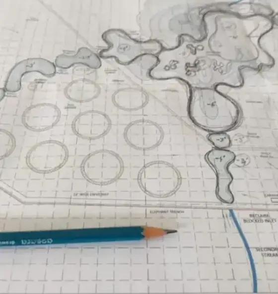 A hand-drawn restoration masterplan showing wetlands, groves and grassland zones.